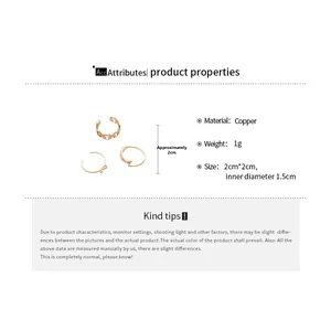 Detailed view of three-piece golden copper ring set with bow design and dimensions