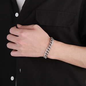 Mens silver 10mm Cuban link chain bracelet in polished stainless steel on wrist