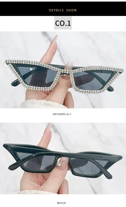 Detail view of cat eye sunglasses with handmade rhinestones on black frames