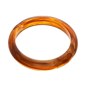 Irregular round amber resin bangle with Maillard style tortoiseshell pattern on white background