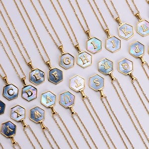 Hexagonal 18k gold plated necklace featuring iridescent shell inlay and initial pendant