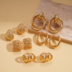 Set of 5 minimalist gold geometric earrings including heart shapes and textured drops