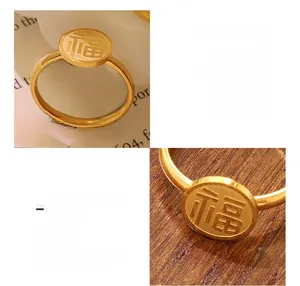Detailed close-up of 18K gold-plated titanium steel ring with Chinese Fu character relief