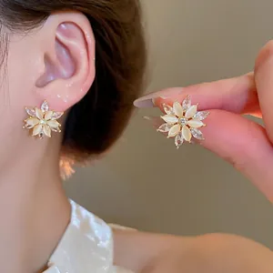 Exquisite gold-plated flower stud earrings with cat eye stone and cubic zirconia petals