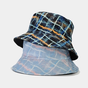 Reversible bucket hat set with abstract graffiti plaid pattern in blue and orange colors