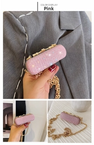 Detailed macro view of pink glitter mini bag with gold chain strap and metal frame