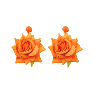 Elegant orange fabric rose earrings with green leaves on a clean white background