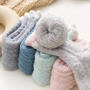 Thick coral fleece socks in pastel colors with warm fluffy texture for winter
