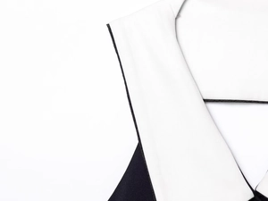 Dettaglio ravvicinato del tessuto a maglia in contrasto bianco e nero con trama fine