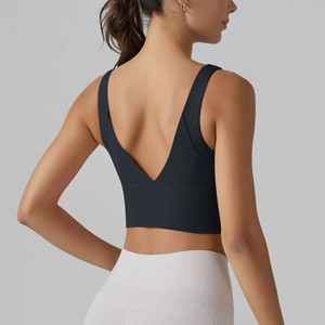 Detail of black V-back sports bra featuring cross-straps and wide supportive bands