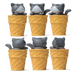 Detail view showing gray striped cats sitting in yellow waffle ice cream cone figurines