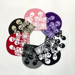 Knit beanie collection with skull patterns in various colors on a white background
