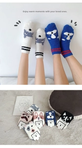 Detailed view of thick coral fleece socks with cute cartoon animal face embroidery