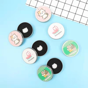 Cosmetic brush cleaning balm set in decorative tins with cat and flamingo patterns
