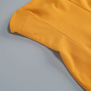 Detailed close-up of the fine industrial stitching on this bright yellow tube dress