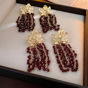 Vintage long grape leaf tassel earrings with gold hollow leaves and red beads