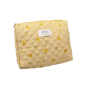 Quilted cotton makeup bag in yellow plaid with cute lemon print and zipper closure