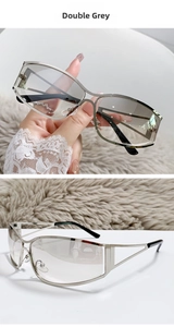 Detail of silver Y2K wrap-around sunglasses with grey lenses and geometric cutouts