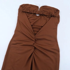 Close-up of the brown backless jumpsuit showing ruched details and cutout design