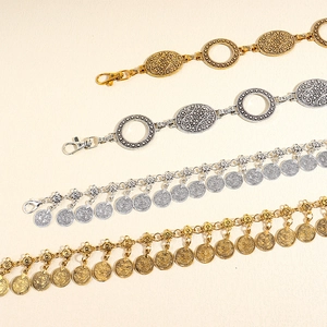 Vintage metal waist belts with coins and tassels in antique gold and silver finishes
