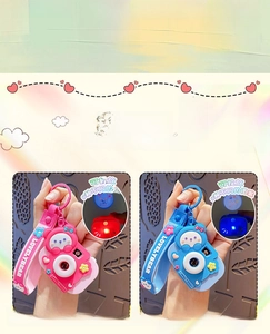 Detailed view of kids toy projection camera keychain showing 8 different cartoon patterns