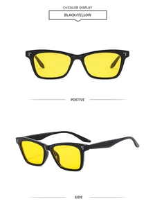 Detail shot of vintage square sunglasses with black frames and yellow tinted lenses