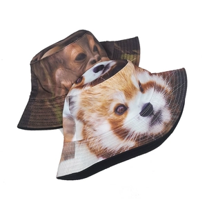 Detail view of double-sided bucket hats featuring realistic gorilla and red panda prints