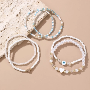 6-piece bohemian beaded bracelet set with devil's eye and heart charms in blue and white