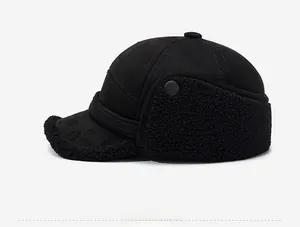 Side view detail of winter thermal earflap hat with black faux suede and warm sherpa lining