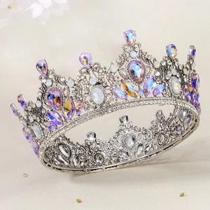 Detail of baroque bridal crown with colorful crystals and intricate silver metalwork