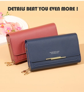 Detail of dual-zipper long wallets in navy and wine red with gold metal trim