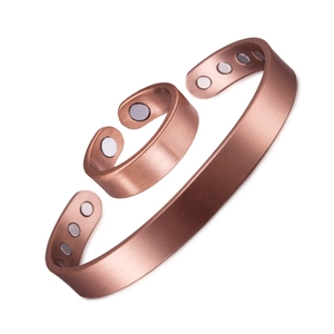 Adjustable magnetic therapy jewelry set with copper-colored brushed metal cuff and ring