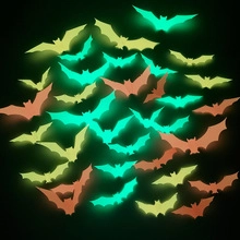 Glow-in-the-dark green and orange bat magnets for Halloween garage door decor