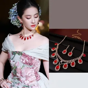 Sparkling red teardrop gemstone jewelry set with necklace and earrings in gold finish