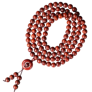 Classic sandalwood 108 prayer beads with decorative tassel and ring on white background