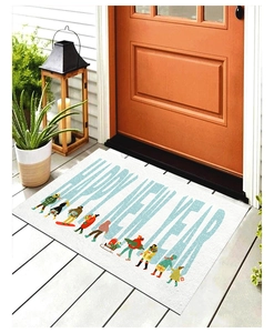 Detailed texture of Happy New Year welcome mat with festive characters on wooden floor