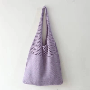Detail of purple knitted tote bag showing diamond hollow mesh and ribbed texture