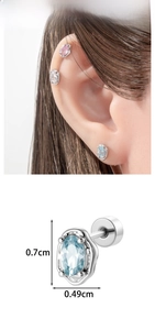 Detailed view of oval zircon cartilage earrings showing 0.7cm x 0.49cm size and screw back