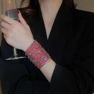 Close-up of sparkling colorful multi-layer rhinestone stretch bracelet on model's wrist