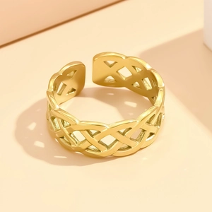 Golden stainless steel knot ring with braided cutout design shown from a top view