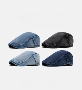 Detail view of denim newsboy caps in four colors featuring side metal adjustment buckles