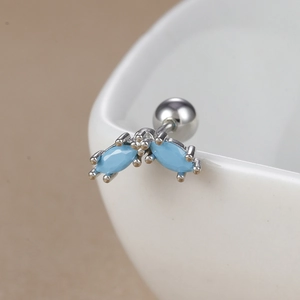 Detail of marquise-shaped turquoise earrings with polished 18K gold stainless steel screw back