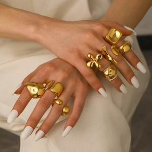 Irregular 18k gold plated stainless steel chunky rings set on model's hand