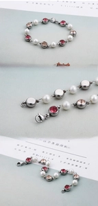 Detail of elegant crystal beaded bracelet with white pearls and champagne stones