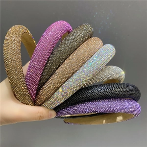 Detail showing various colors of thick padded headbands with micro-set sparkling rhinestones