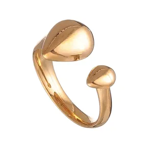 Detail of a minimalist 18k gold plated stainless steel open ring with teardrop design