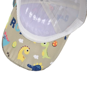 Close-up of dinosaur print kids baseball cap showing inner lining and stitching details