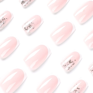 Pink French manicure press-on nails with white tips and silver glitter accents