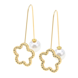 Elegant gold flower earrings with white pearl and sparkling crystals on a white background