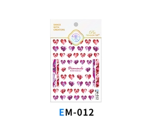 Close-up of heart-shaped crystal nail art stickers EM-012 with pink and red textures